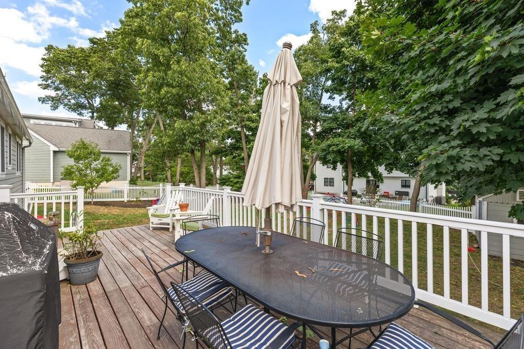 18 Moccasin Path Arlington, MA 02474 - Photo 28 of 33 a view of balcony with wooden floor and outdoor seating