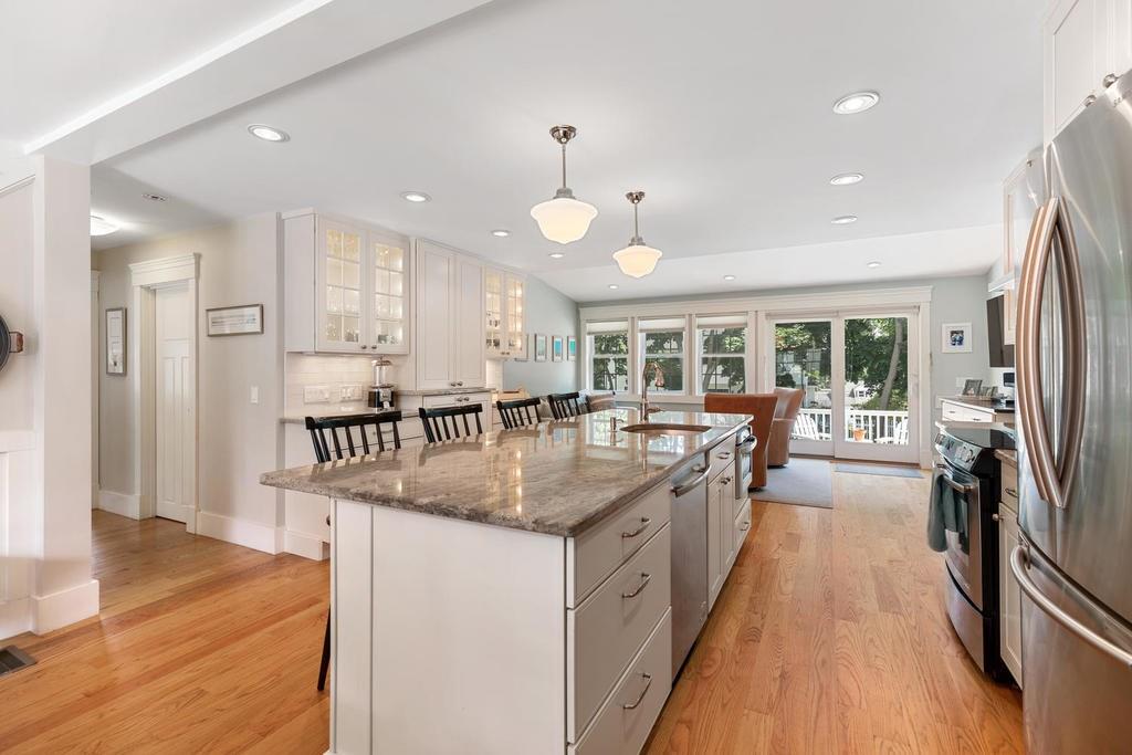 18 Moccasin Path Arlington, MA 02474 - Photo 9 of 33 a kitchen with counter top space a sink appliances and cabinets