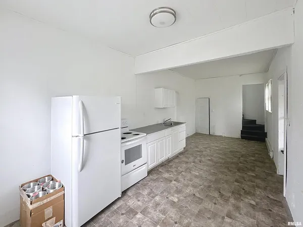 a bathroom with a toilet sink and bathtub
