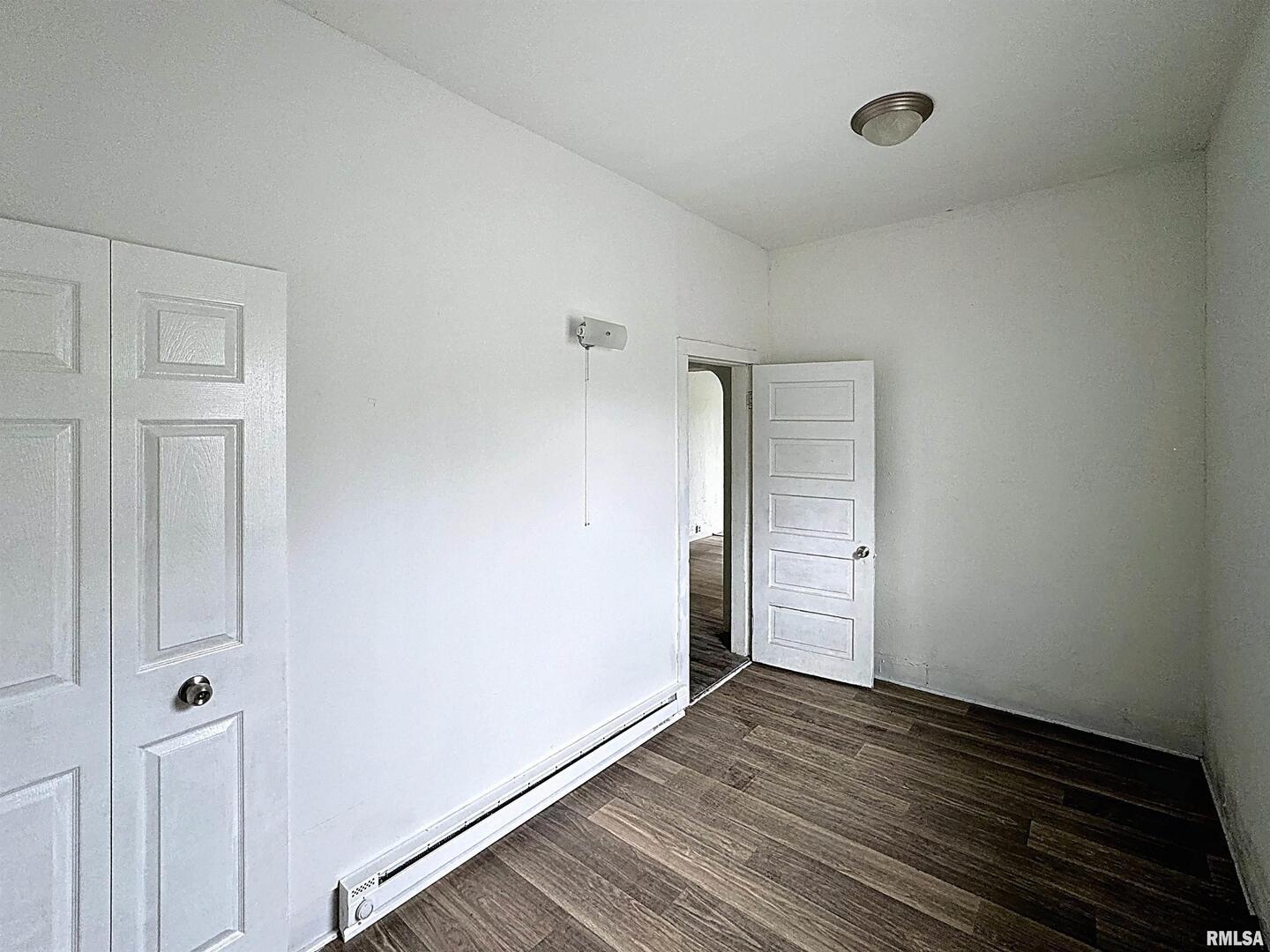204 Main Avenue Matherville, IL 61263 - Photo 16 of 27 a view of an empty room with wooden floor