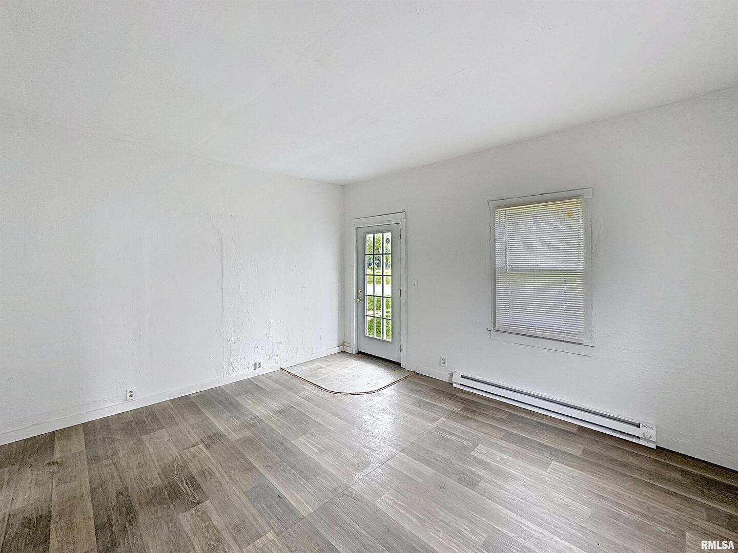 204 Main Avenue Matherville, IL 61263 - Photo 6 of 27 an empty room with windows