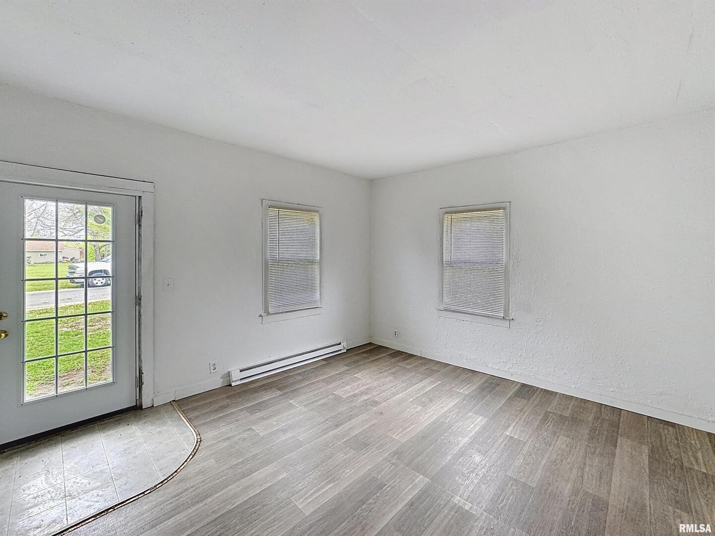 204 Main Avenue Matherville, IL 61263 - Photo 7 of 27 an empty room with windows