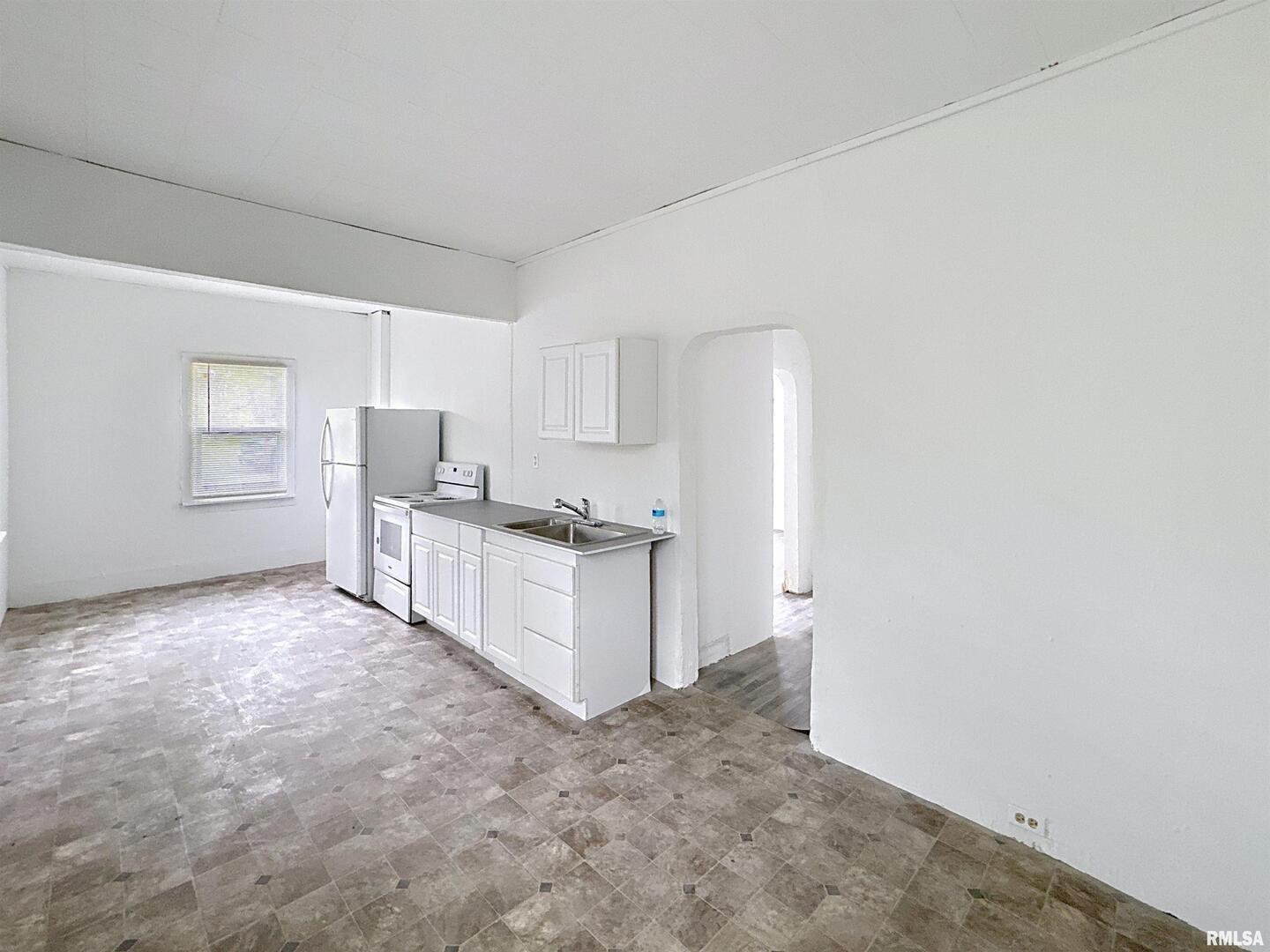 204 Main Avenue Matherville, IL 61263 - Photo 10 of 27 a view of a kitchen with refrigerator and windows