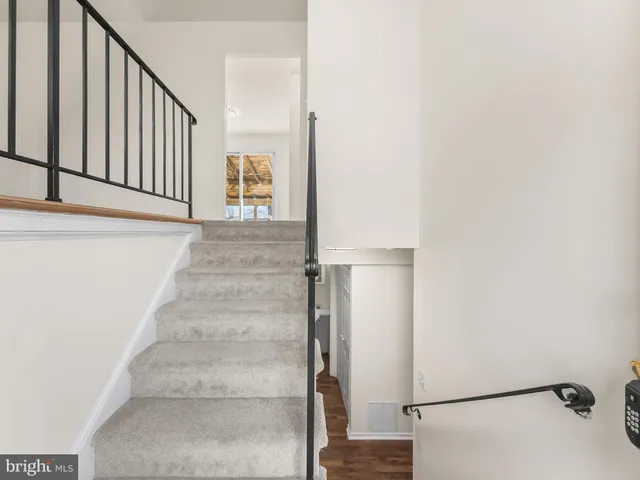a view of entryway with wooden floor