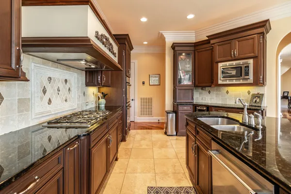 a kitchen with counter top space a sink and cabinets