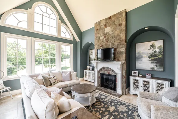 a living room with a fireplace and a fireplace