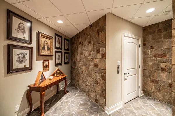 a living room with furniture and large windows