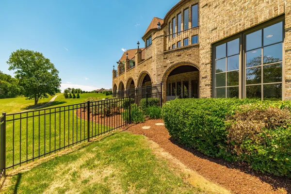 a view of a swimming pool with a lawn chairs