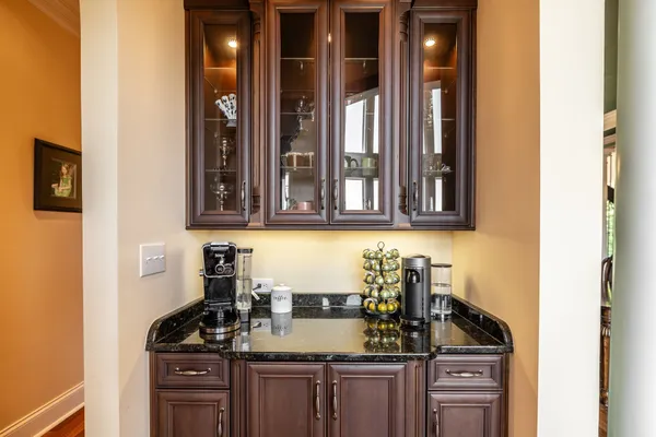 a kitchen with stainless steel appliances granite countertop a refrigerator and a stove top oven