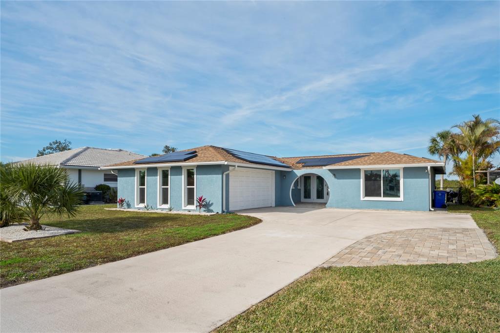 3943 Topsail Trail New Port Richey, FL 34652 - Photo 1 of 1 a front view of a house with a garden