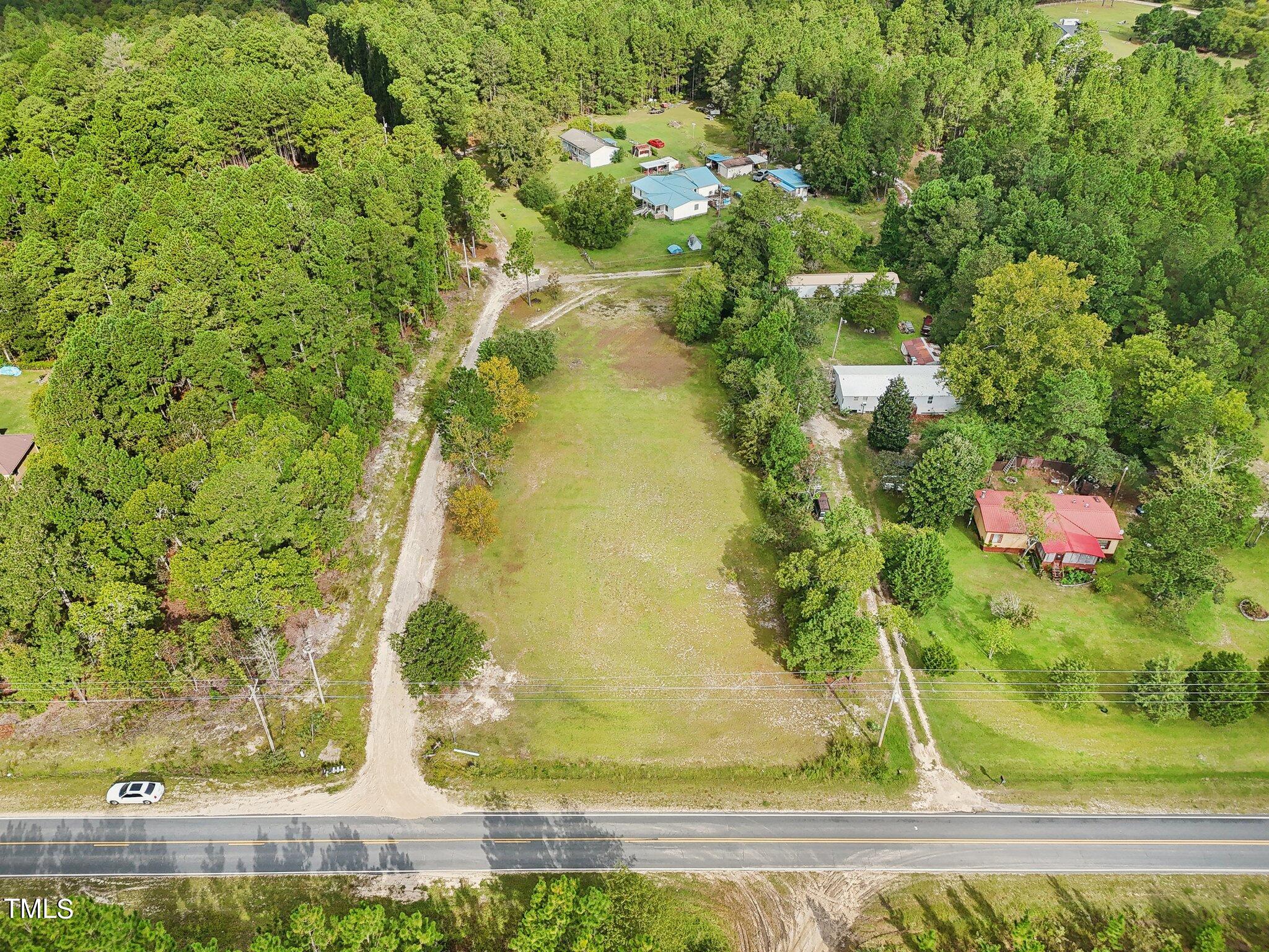 60 Hale Storm Lane Cameron, NC 28326 - Photo 12 of 24 a view of a garden with a bench