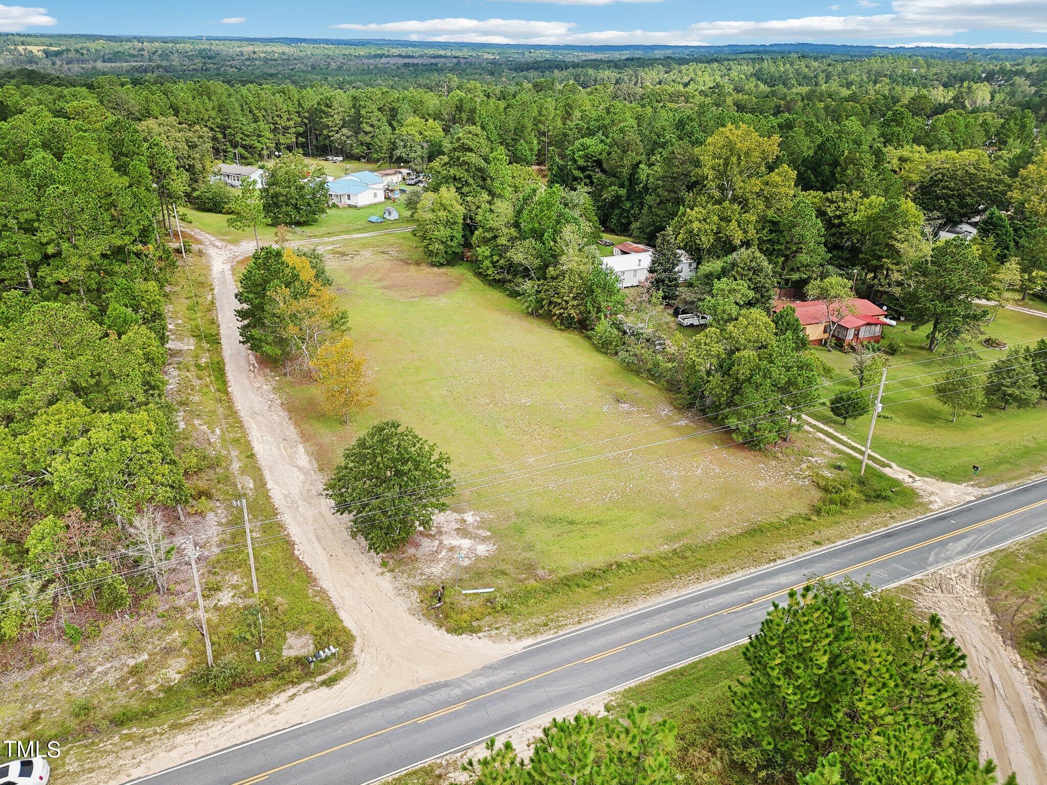 60 Hale Storm Lane Cameron, NC 28326 - Photo 7 of 24 a view of a garden with a bench