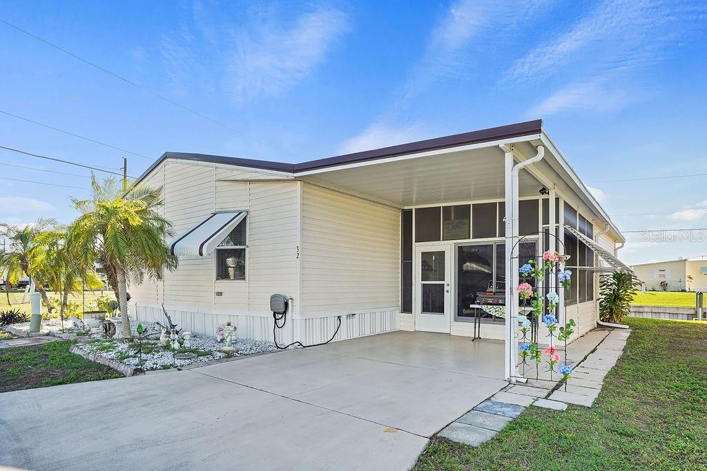 10101 Burnt Store Road, Unit 32 Punta Gorda, FL 33950 - Photo 1 of 1 a view of a house with a patio