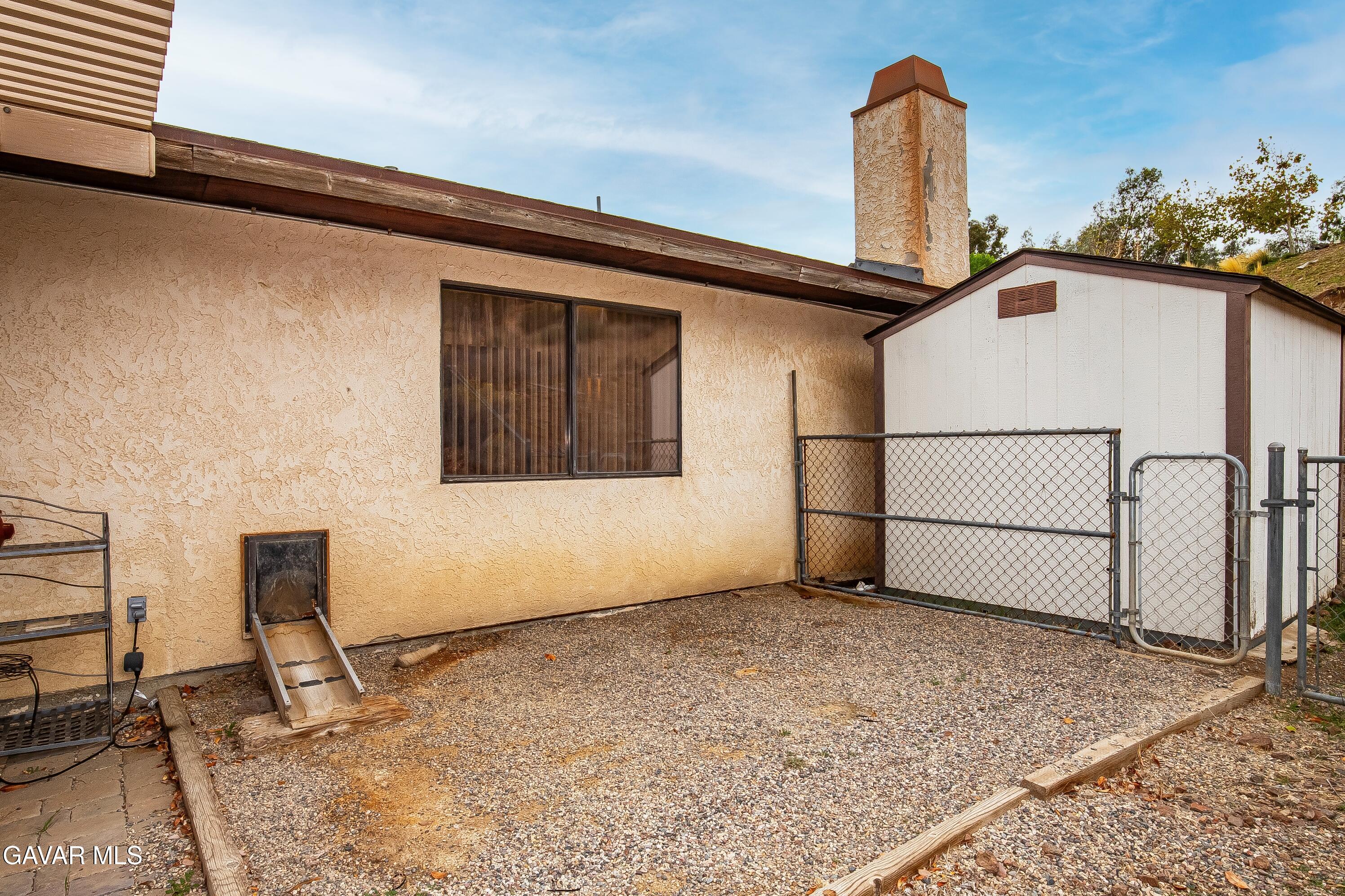 31741 Lake Meadow Road Acton, CA 93510 - Photo 21 of 59 a view of a house with a wooden bench
