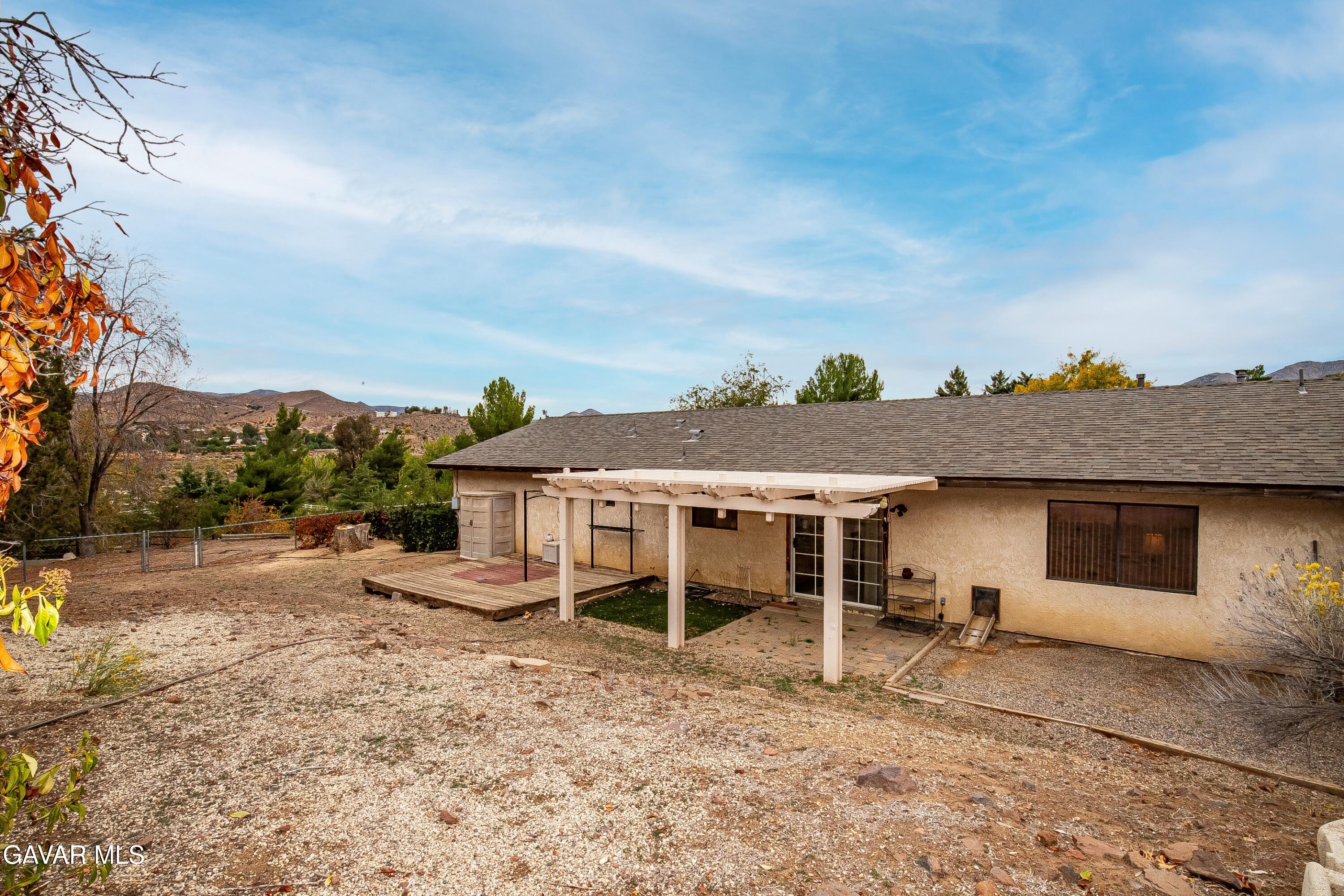 31741 Lake Meadow Road Acton, CA 93510 - Photo 22 of 59 a view of a house with backyard and a tree