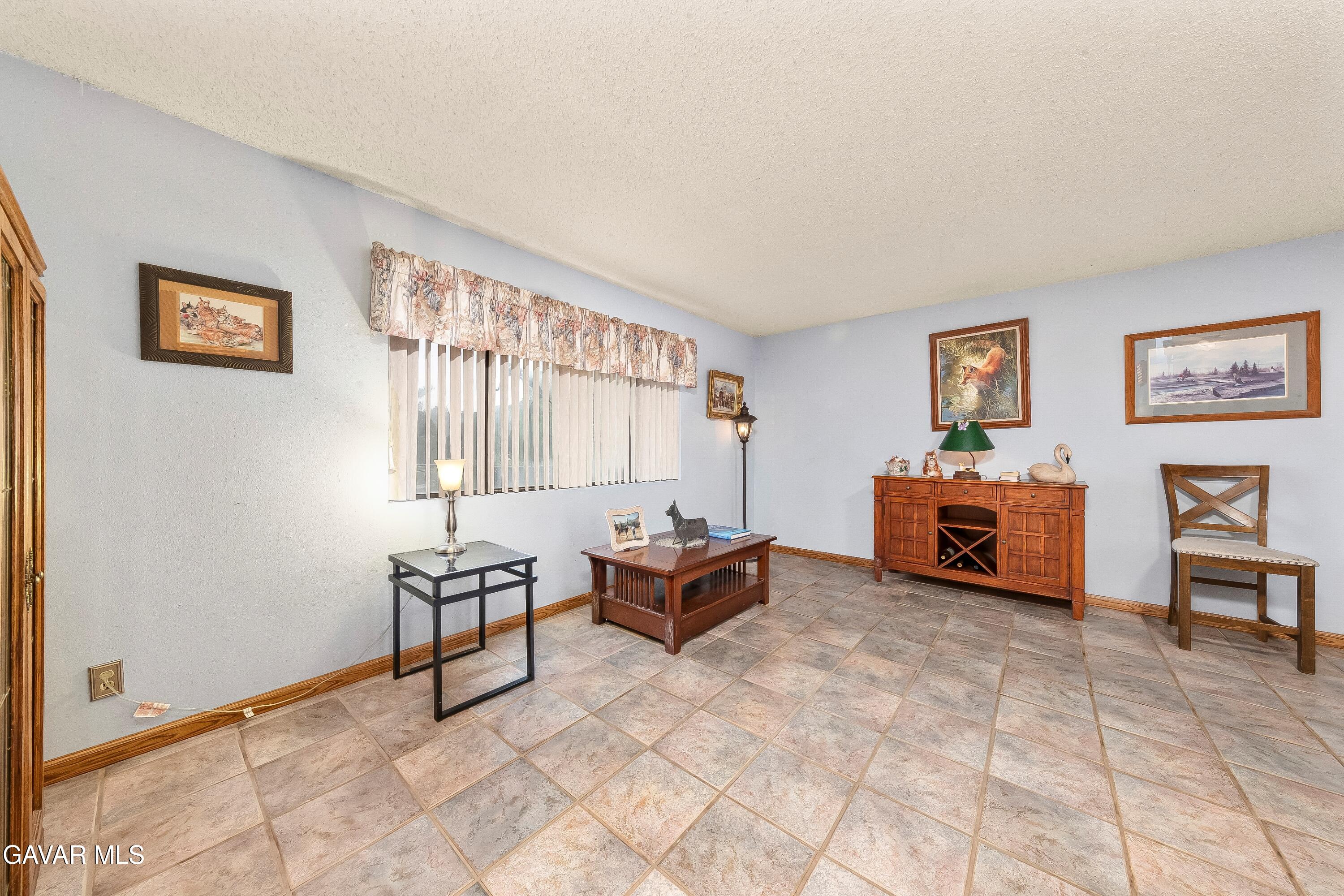 31741 Lake Meadow Road Acton, CA 93510 - Photo 5 of 59 a living room with furniture and a large window