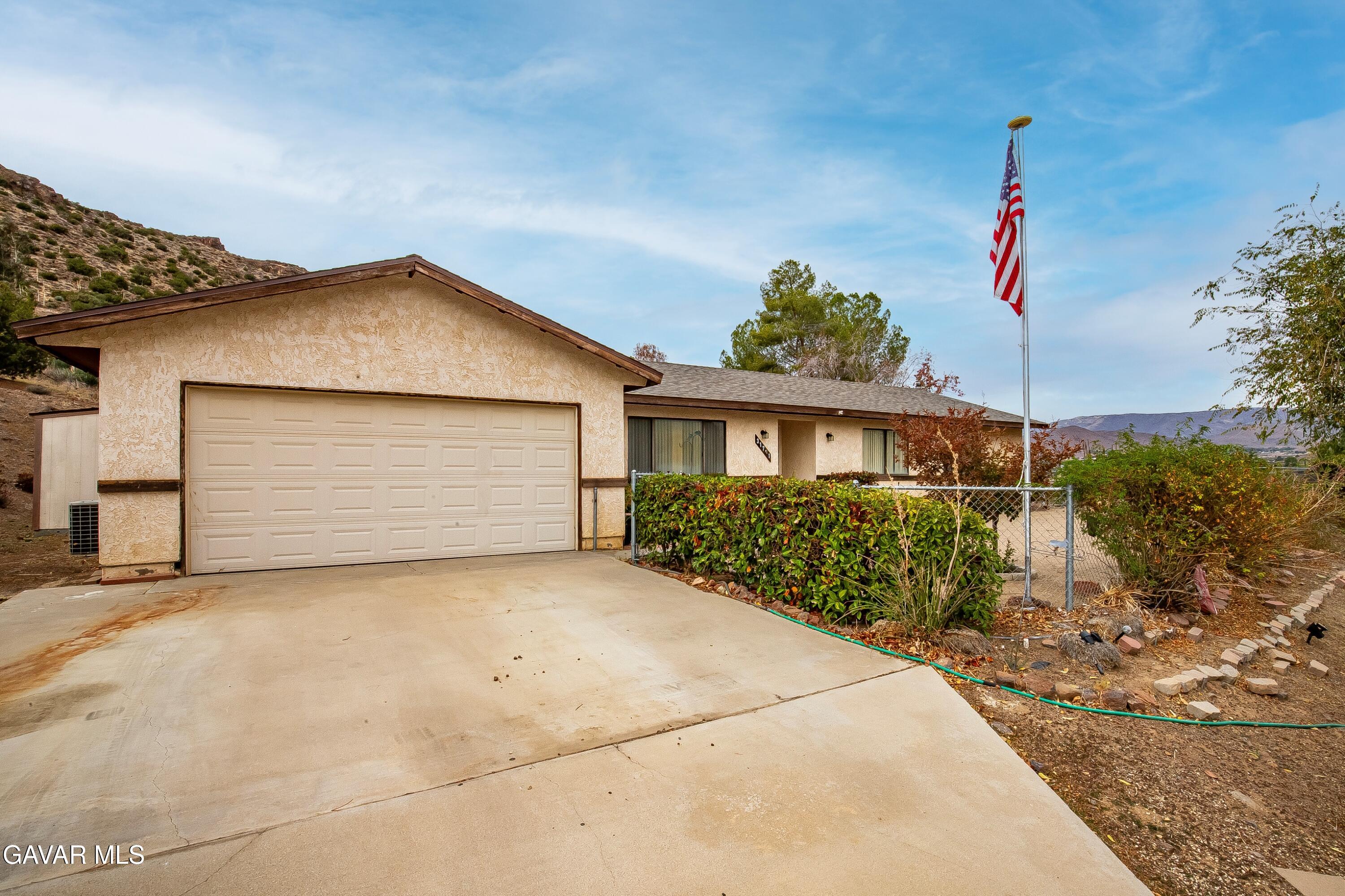 31741 Lake Meadow Road Acton, CA 93510 - Photo 52 of 59 a view of a house with a yard and potted plants