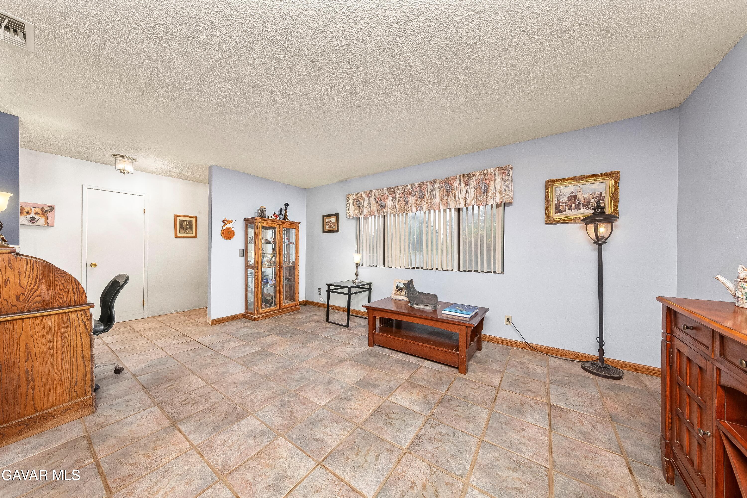 31741 Lake Meadow Road Acton, CA 93510 - Photo 6 of 59 a view of livingroom with furniture and a flat screen tv