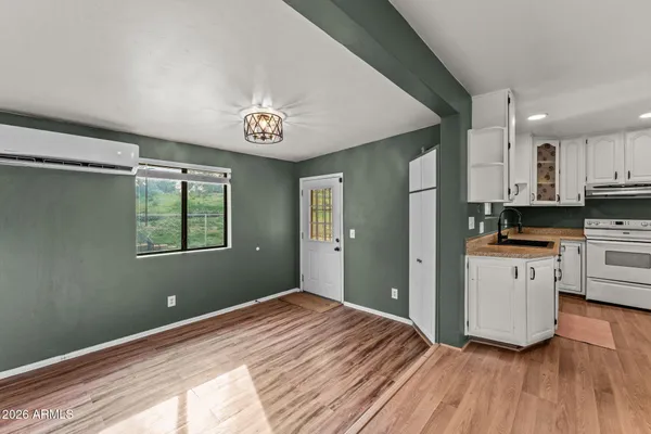 a kitchen with a sink and large window