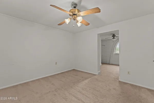 a view of an empty room with a window