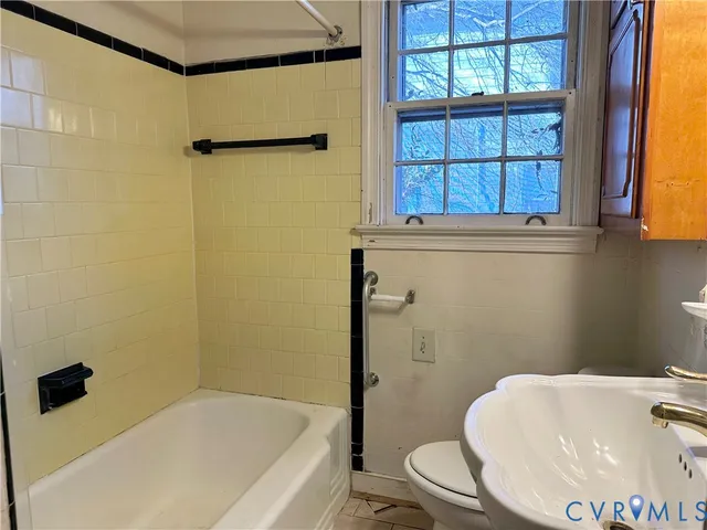 a bathroom with a sink and a bathtub