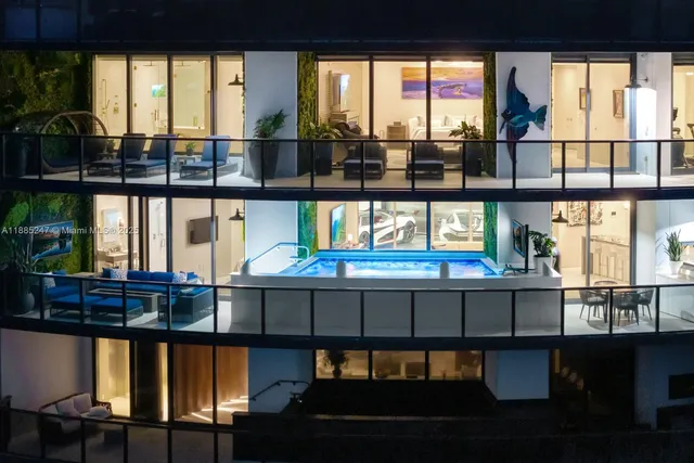 a kitchen with stainless steel appliances kitchen island granite top and refrigerator