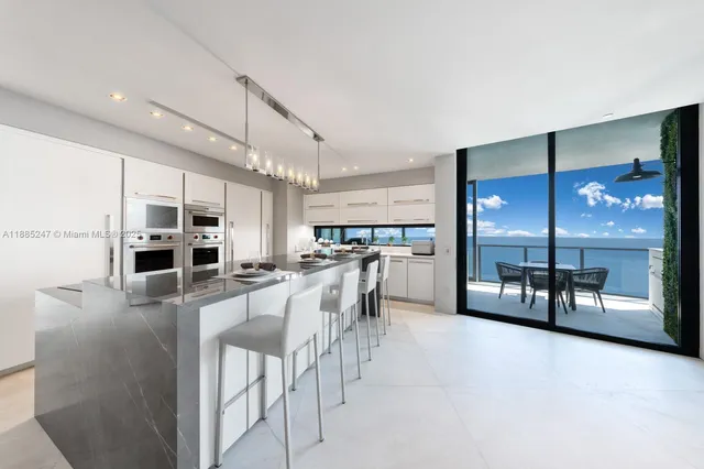 a bedroom with a large bed and a balcony view