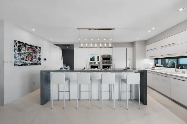 a bedroom with a large bed and a large window