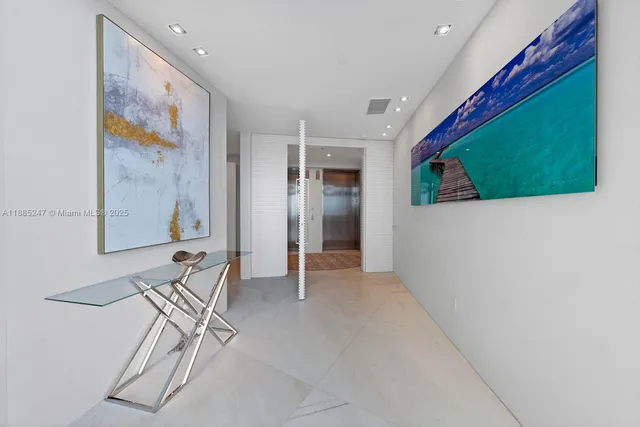 a large bedroom with a large bed and a large window