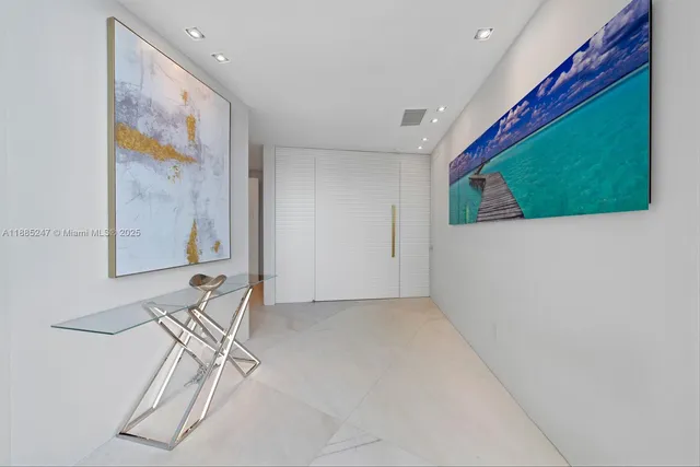 a large bedroom with a large bed and a flat screen tv