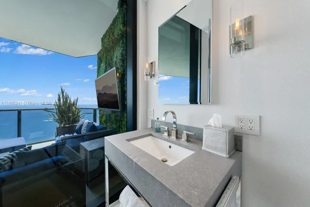 a spacious bathroom with a double vanity sink a mirror and a shower