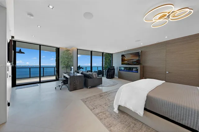 a view of a balcony with chandelier fan and wooden floor
