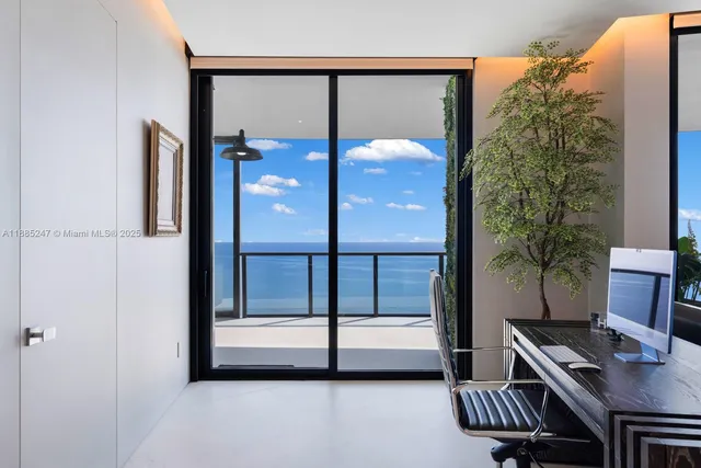 a view of a chairs and table in the balcony