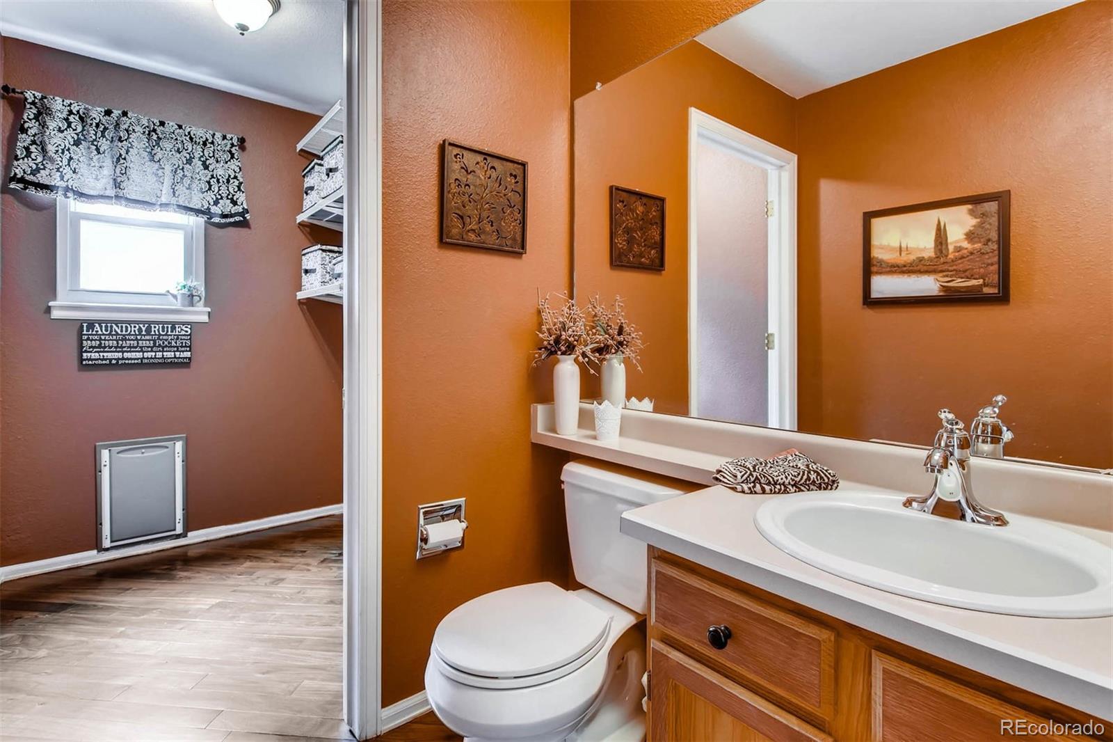 13360 Cherry Circle Thornton, CO 80241 - Photo 15 of 26 a bathroom with a granite countertop toilet sink and mirror