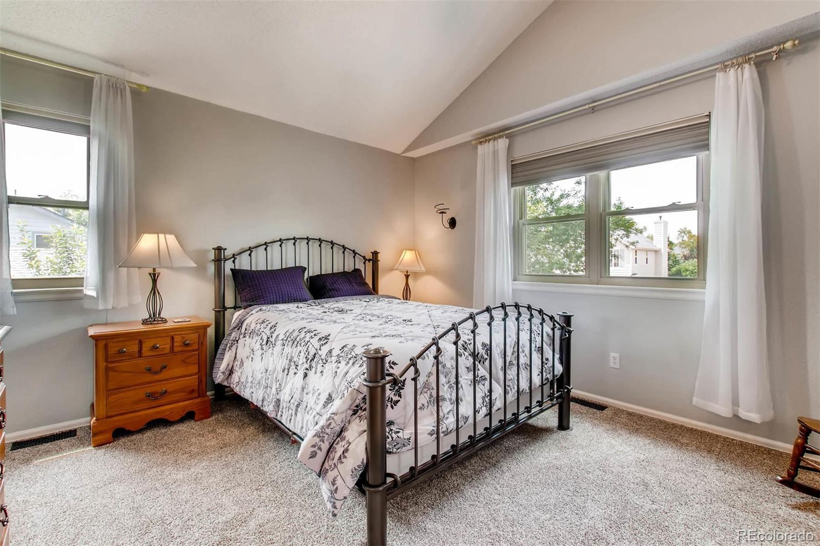 13360 Cherry Circle Thornton, CO 80241 - Photo 16 of 26 a bedroom with a bed chair and window