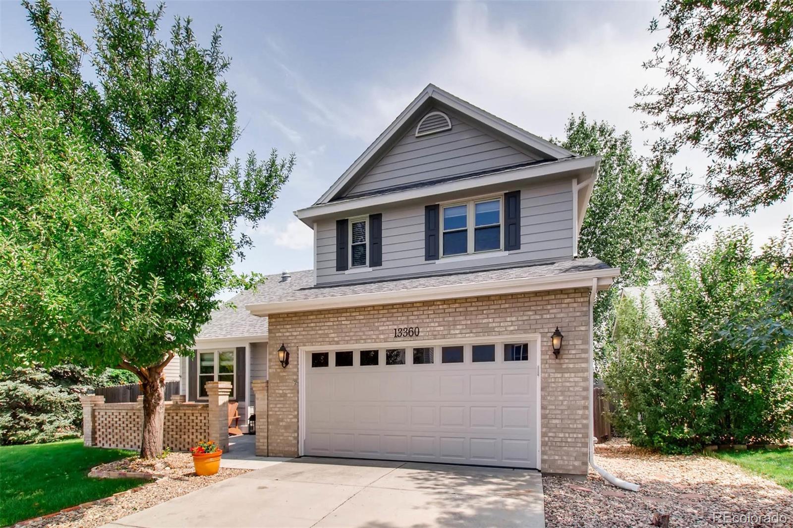13360 Cherry Circle Thornton, CO 80241 - Photo 2 of 26 a front view of a house with street