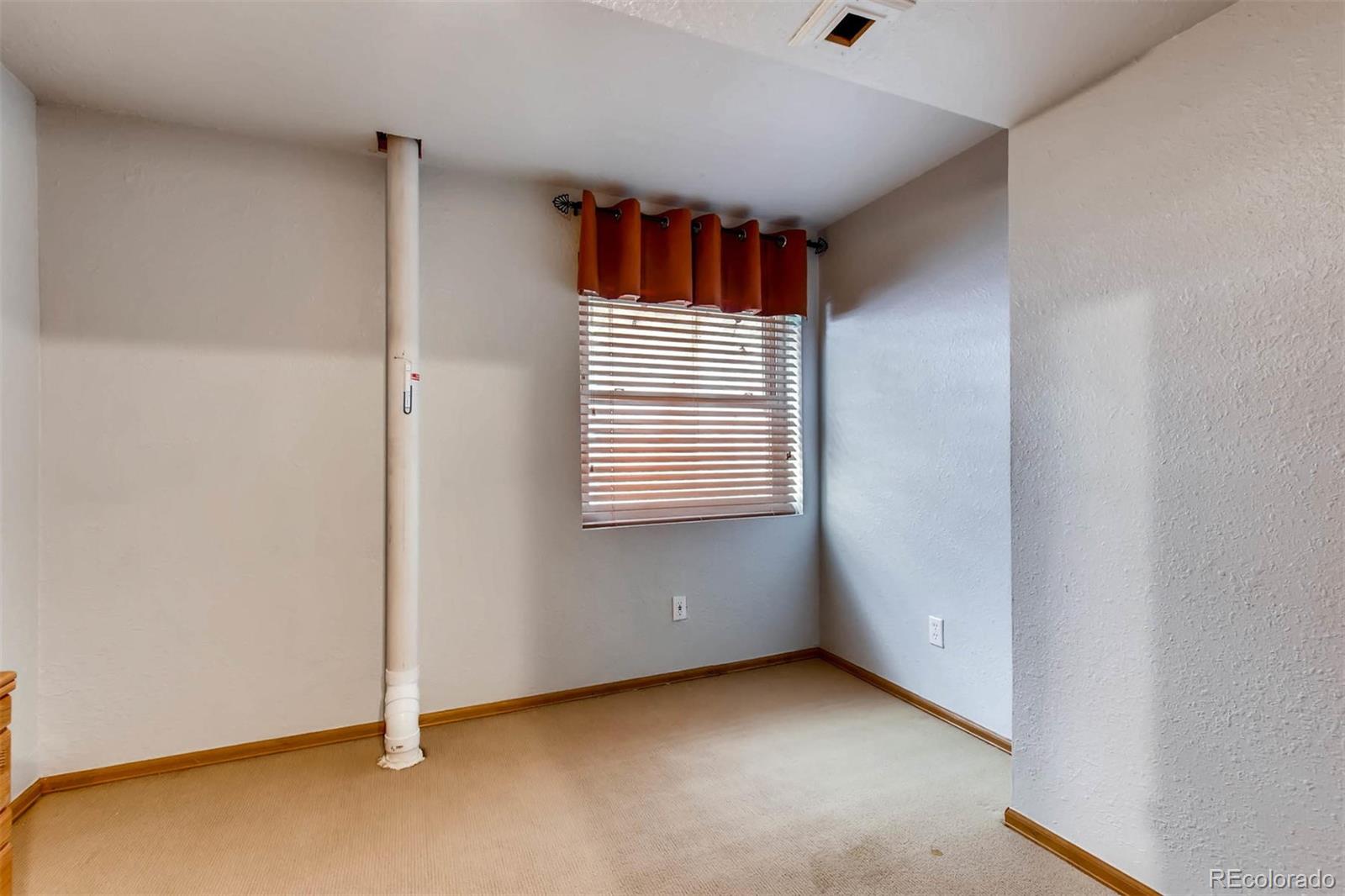 13360 Cherry Circle Thornton, CO 80241 - Photo 22 of 26 a view of an empty room with a window