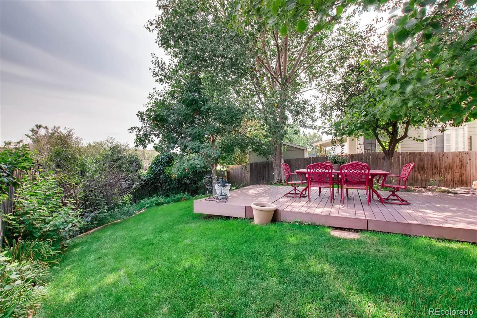 13360 Cherry Circle Thornton, CO 80241 - Photo 26 of 26 a view of a yard with furniture and garden