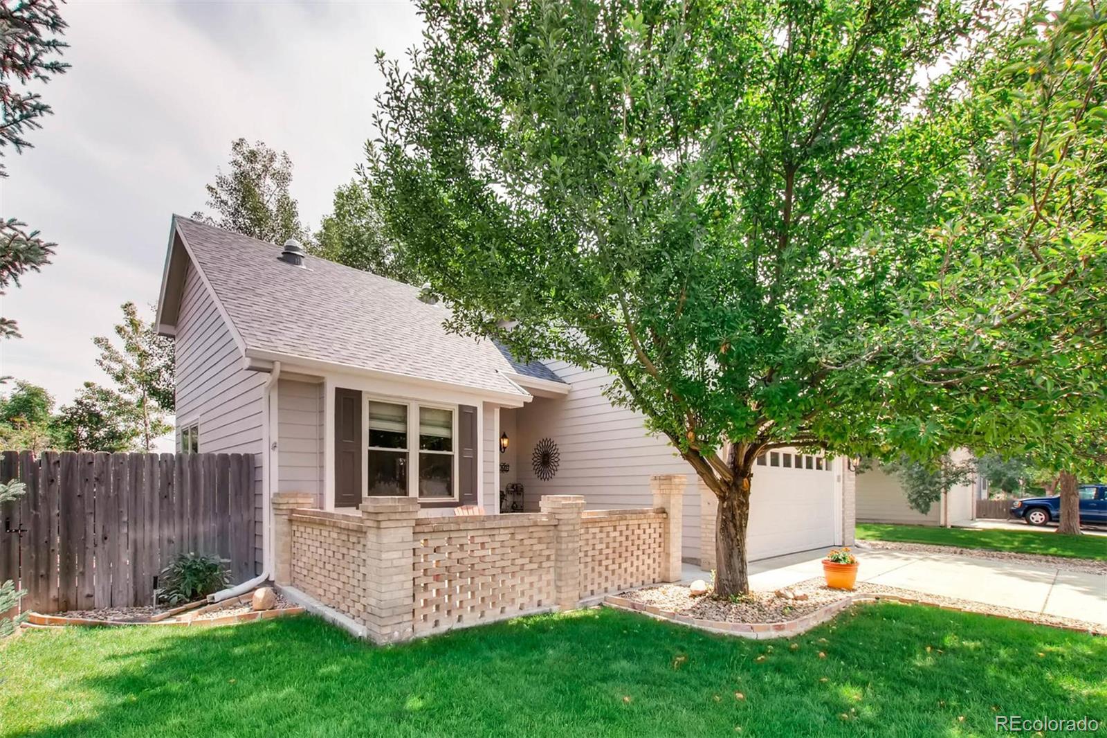 13360 Cherry Circle Thornton, CO 80241 - Photo 3 of 26 a view of a house with backyard and a tree