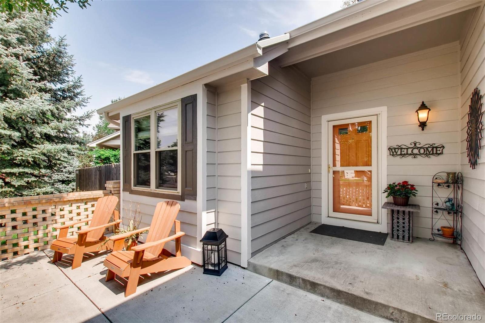 13360 Cherry Circle Thornton, CO 80241 - Photo 4 of 26 a backyard of a house with sofas
