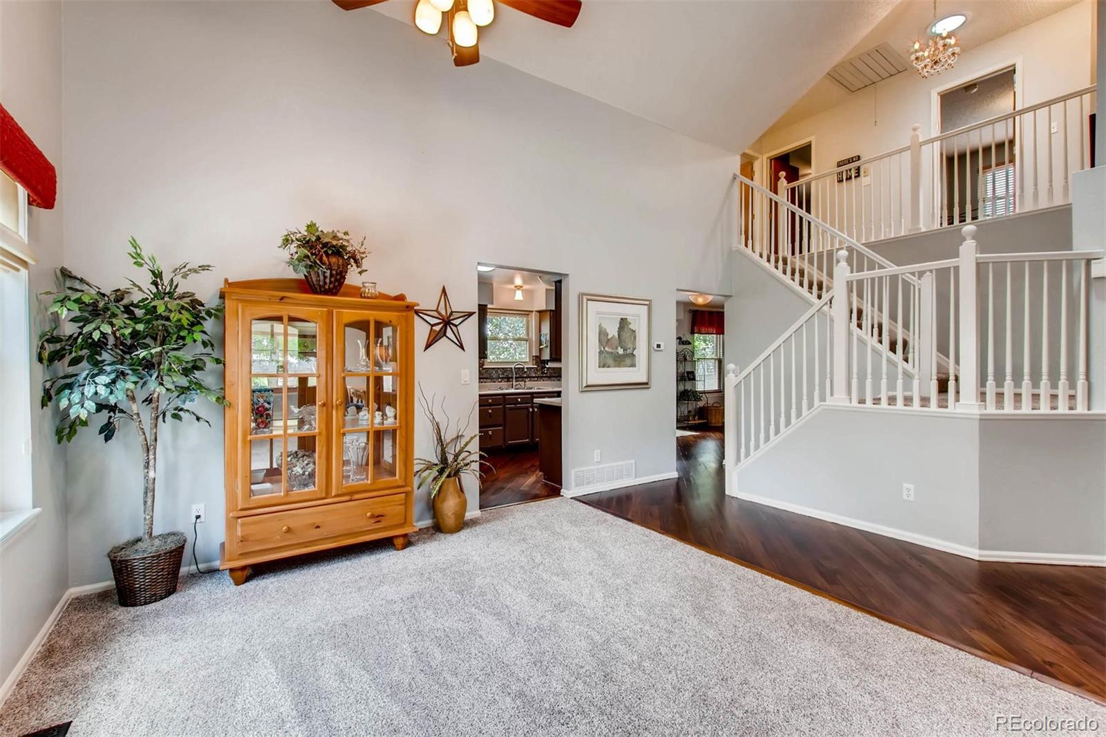 13360 Cherry Circle Thornton, CO 80241 - Photo 7 of 26 a view of an empty room with workspace and stairs