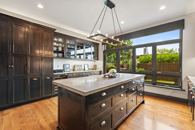 a kitchen with a stove and a refrigerator