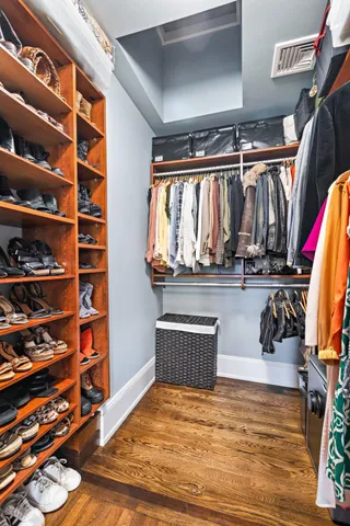 a bedroom with a large bed and a large window