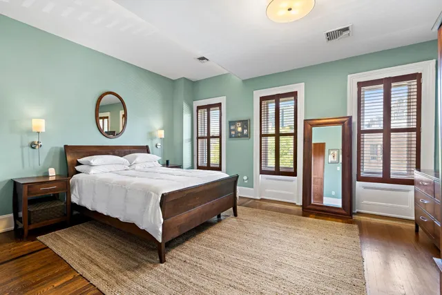 a bedroom with a bed and a television in it