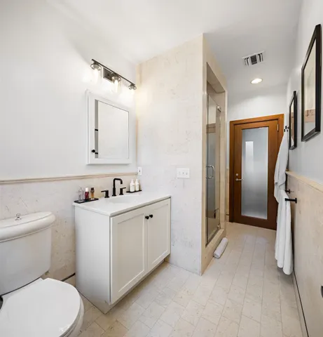 a backyard of a house with outdoor seating and plants