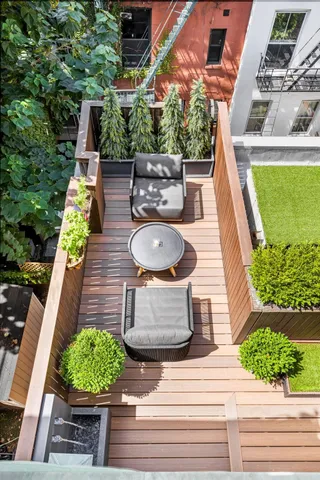 a view of a terrace with couches and pool
