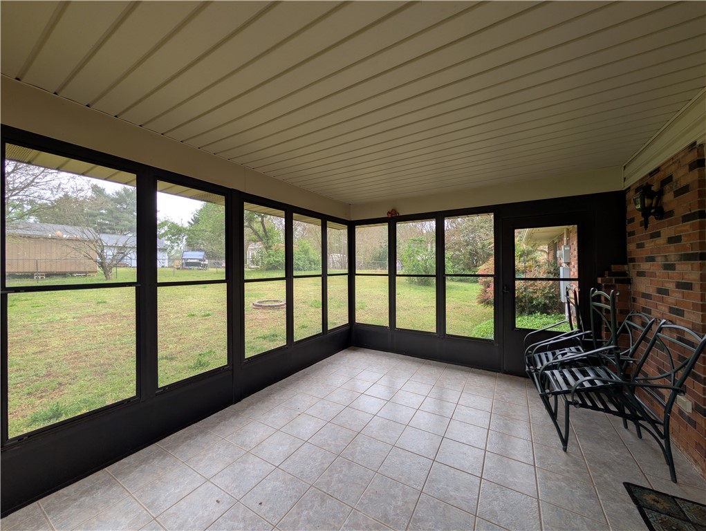 1000 Hickory Lane Anderson, SC 29624 - Photo 32 of 37 Enjoy peaceful outdoor living from this bright screened porch, offering tranquil backyard views.