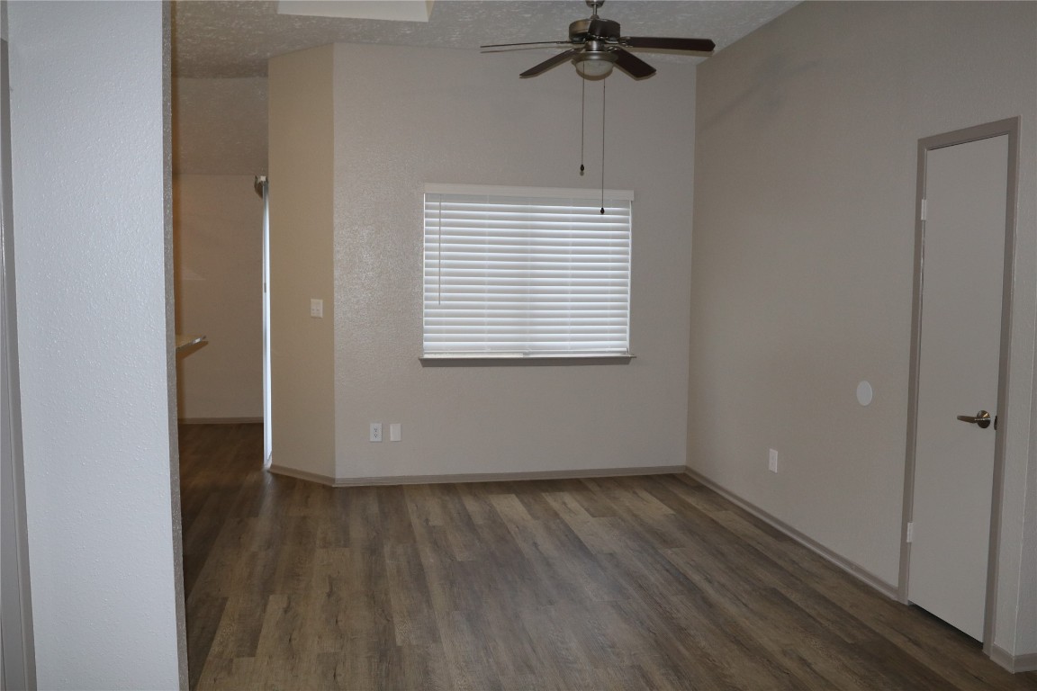11530 Ridge Run Drive Houston, TX 77064 - Photo 12 of 38 an empty room with wooden floor fan and windows