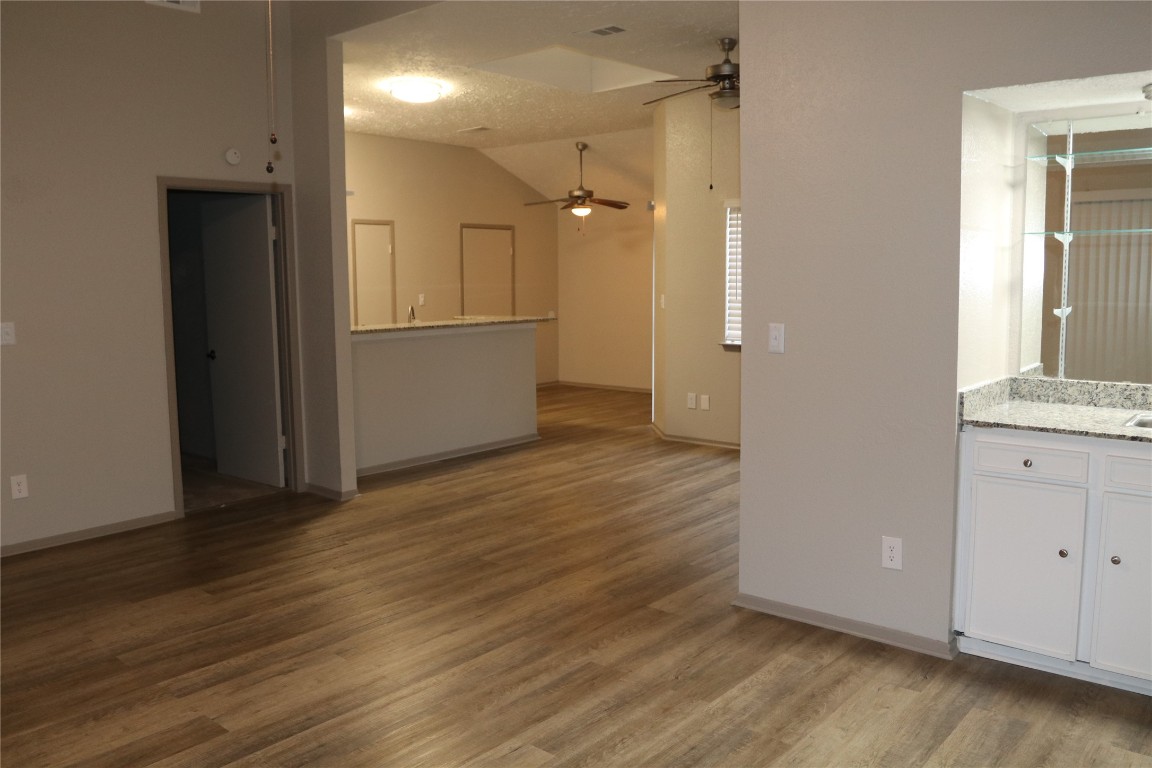 11530 Ridge Run Drive Houston, TX 77064 - Photo 13 of 38 an empty room with wooden floor and windows