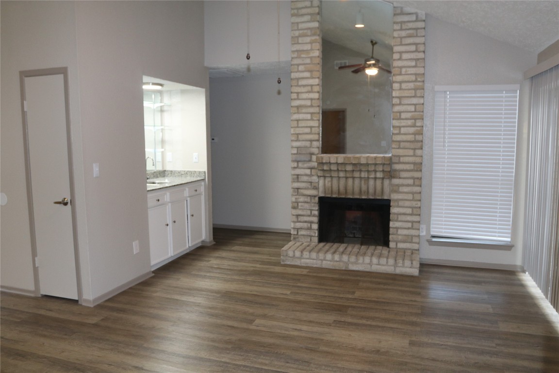 11530 Ridge Run Drive Houston, TX 77064 - Photo 15 of 38 a view of a livingroom with wooden floor and a fireplace
